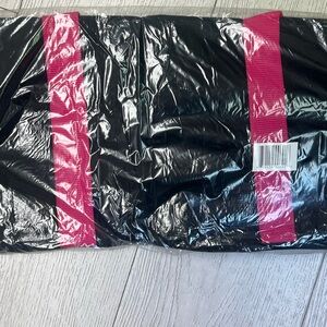 Bloomingdale’s pink and black duffle bag
